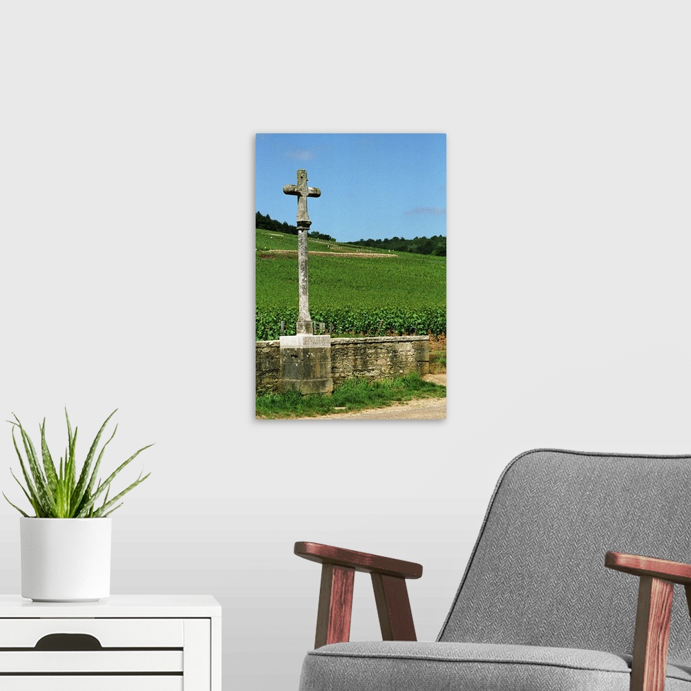 A modern room featuring The stone cross marking the Romanee Conti and Richebourg vineyards of Domaine de la Romanee Conti...