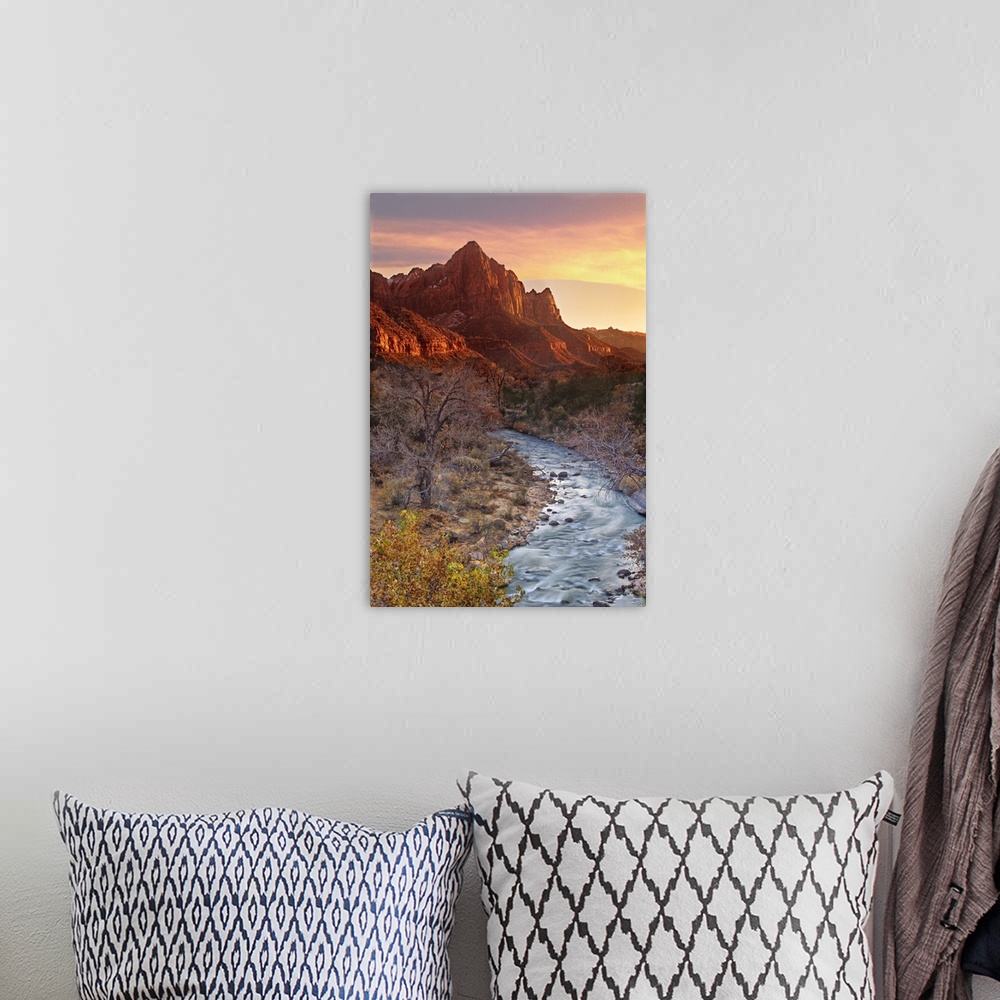 A bohemian room featuring The Watchman, one of the most prominent mountain formations in Zion National Park, lights up at s...