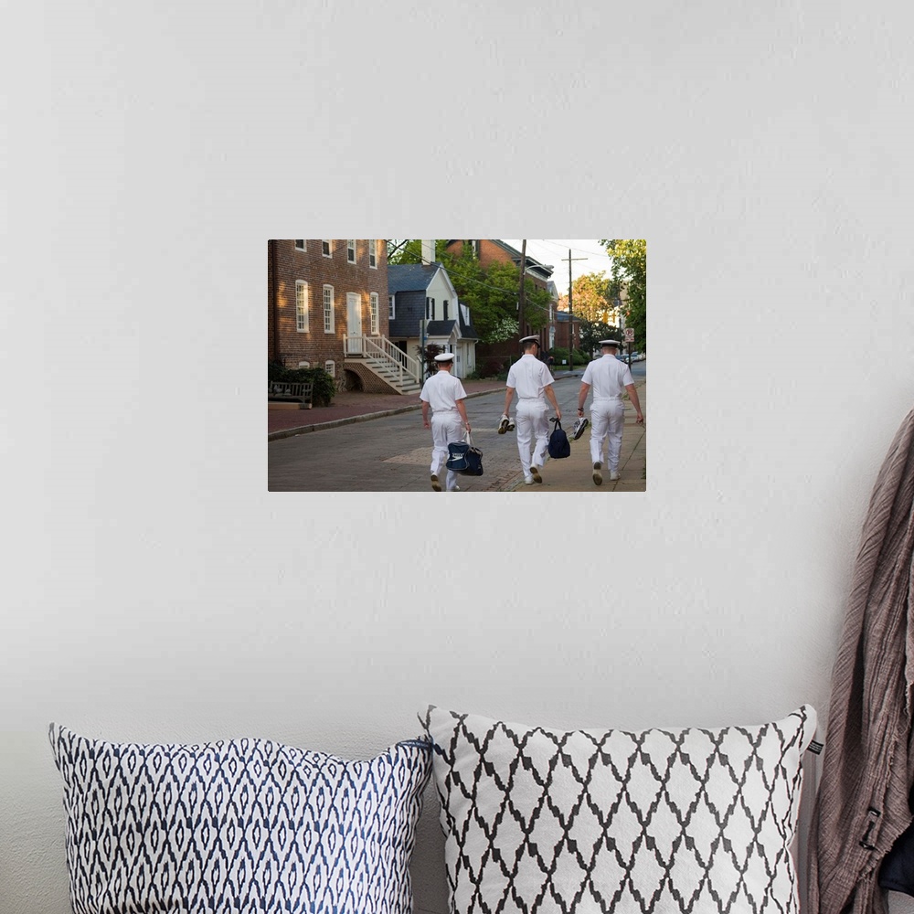 A bohemian room featuring Three male U.S. Navy cadets walk down street with historic homes (viewed from behind), Annapolis,...