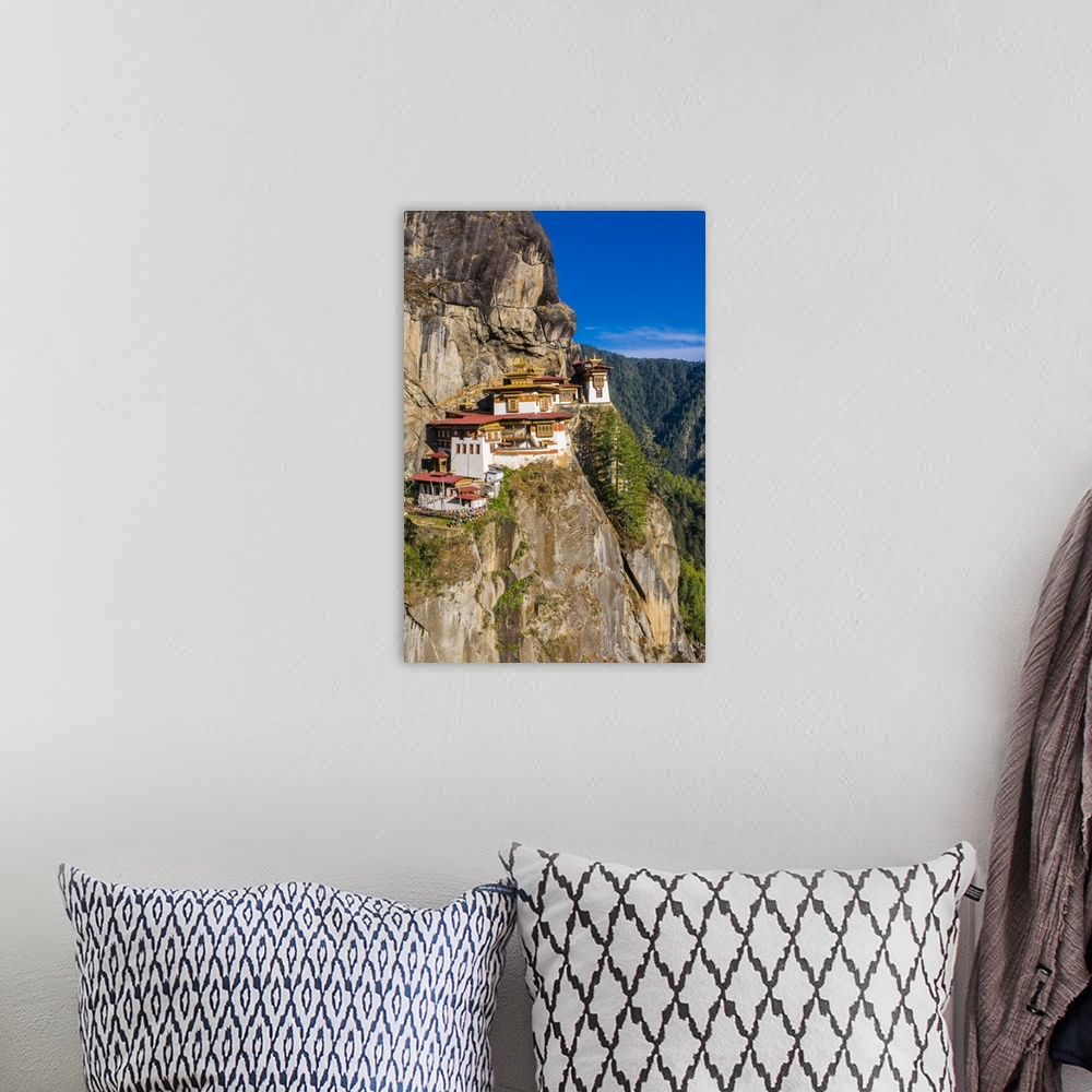 A bohemian room featuring Tiger-Nest, Taktsang Goempa monastery hanging in the cliffs, Bhutan.