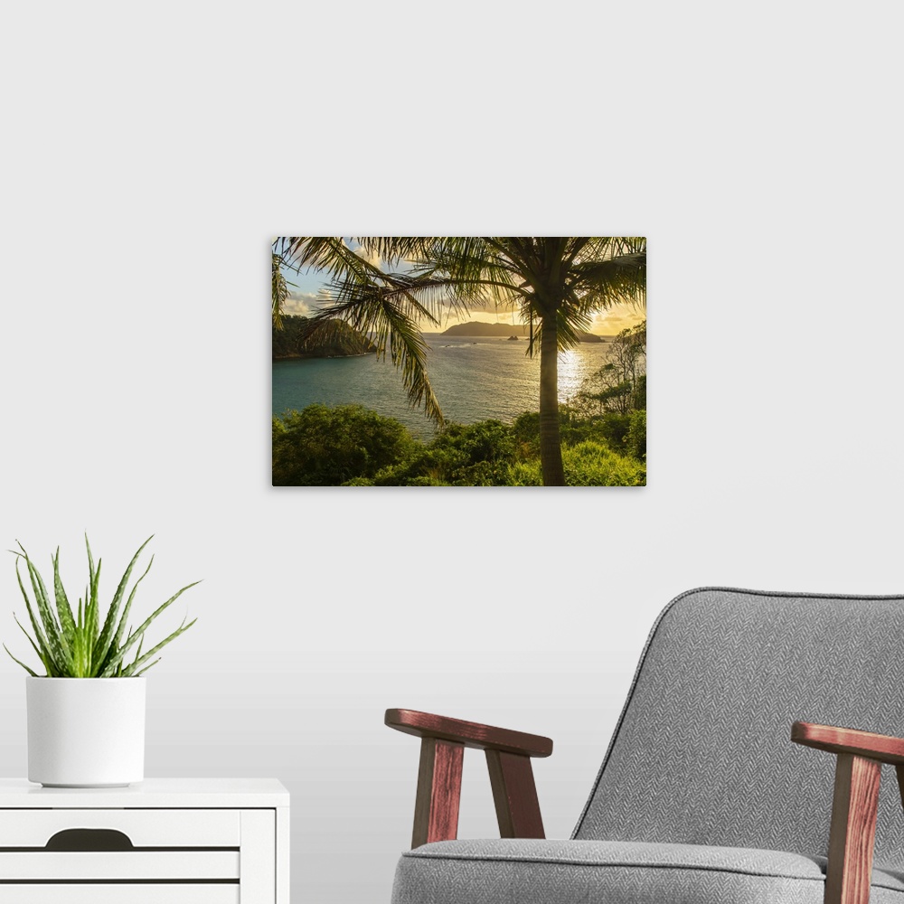 A modern room featuring Tobago. Sunrise on island and ocean.