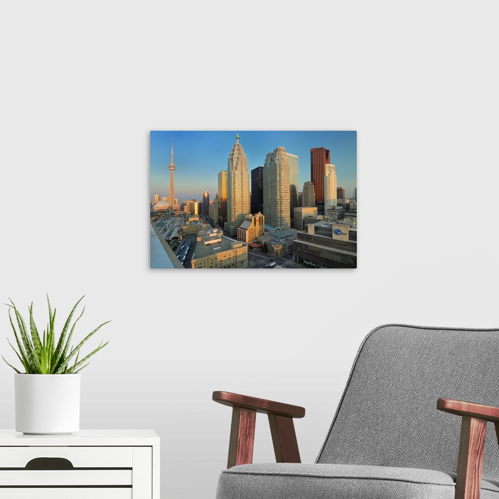 A modern room featuring Toronto. City at dusk with CN Tower.