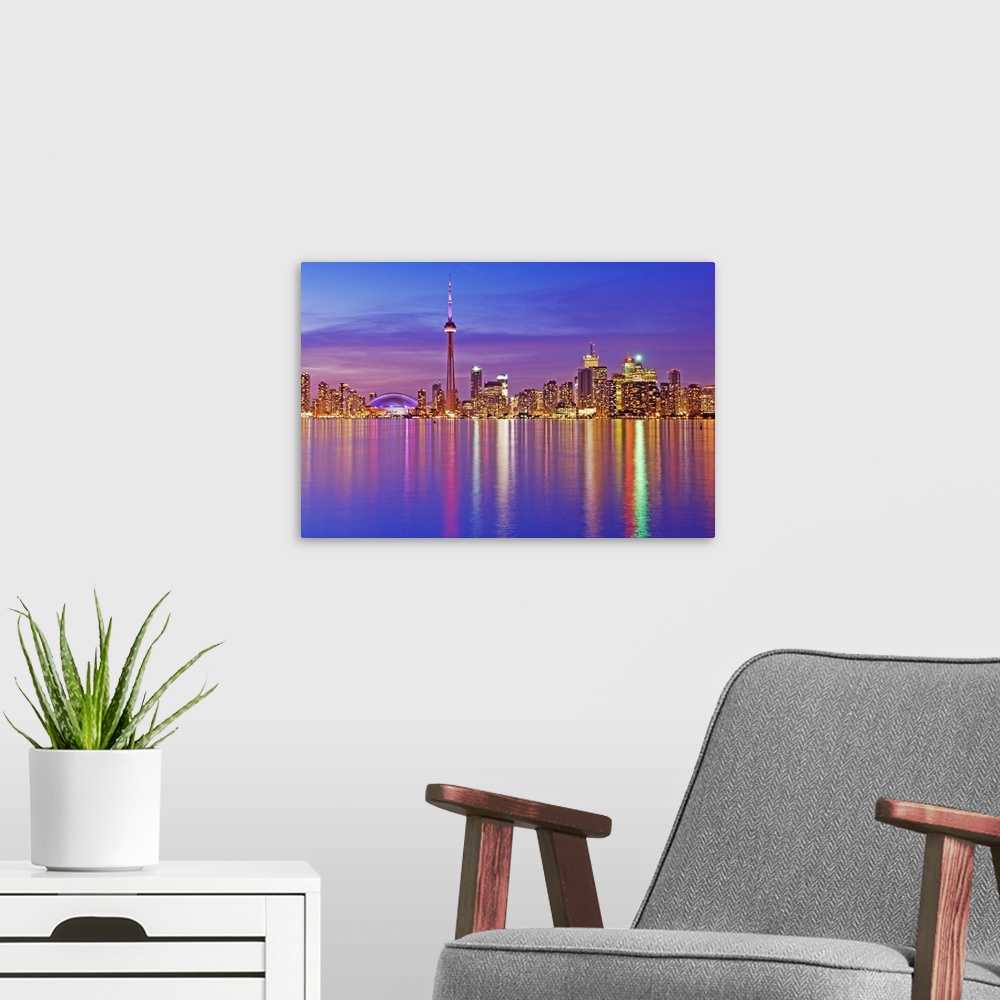 A modern room featuring Toronto Skyline at dusk.
