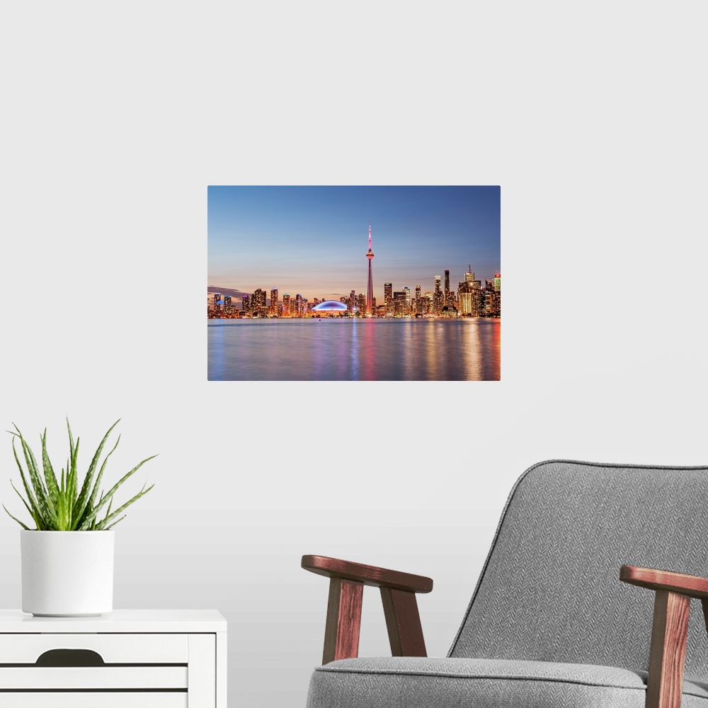 A modern room featuring Toronto Skyline at Sunset from Toronto Islands.