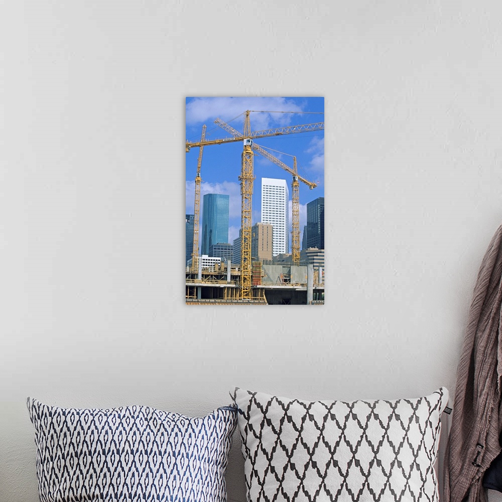 A bohemian room featuring Tower cranes, commercial construction site