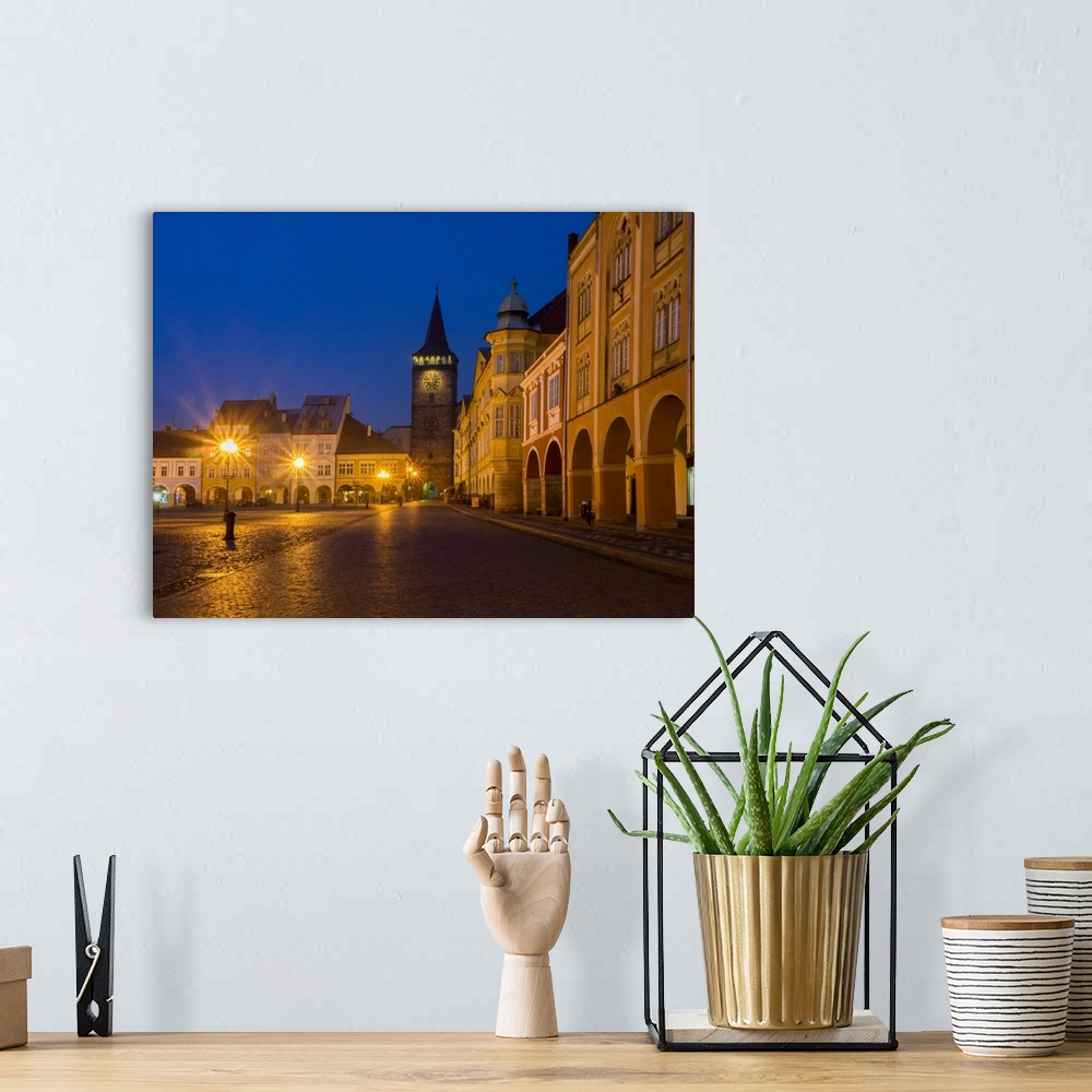 A bohemian room featuring Europe, Czech Republic, Jicin. Twilight in the main square surrounded with recently restored hist...