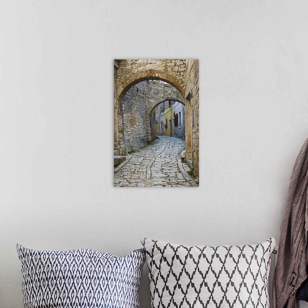 A bohemian room featuring Twin arches above cobblestone stree, Bale, Croatia