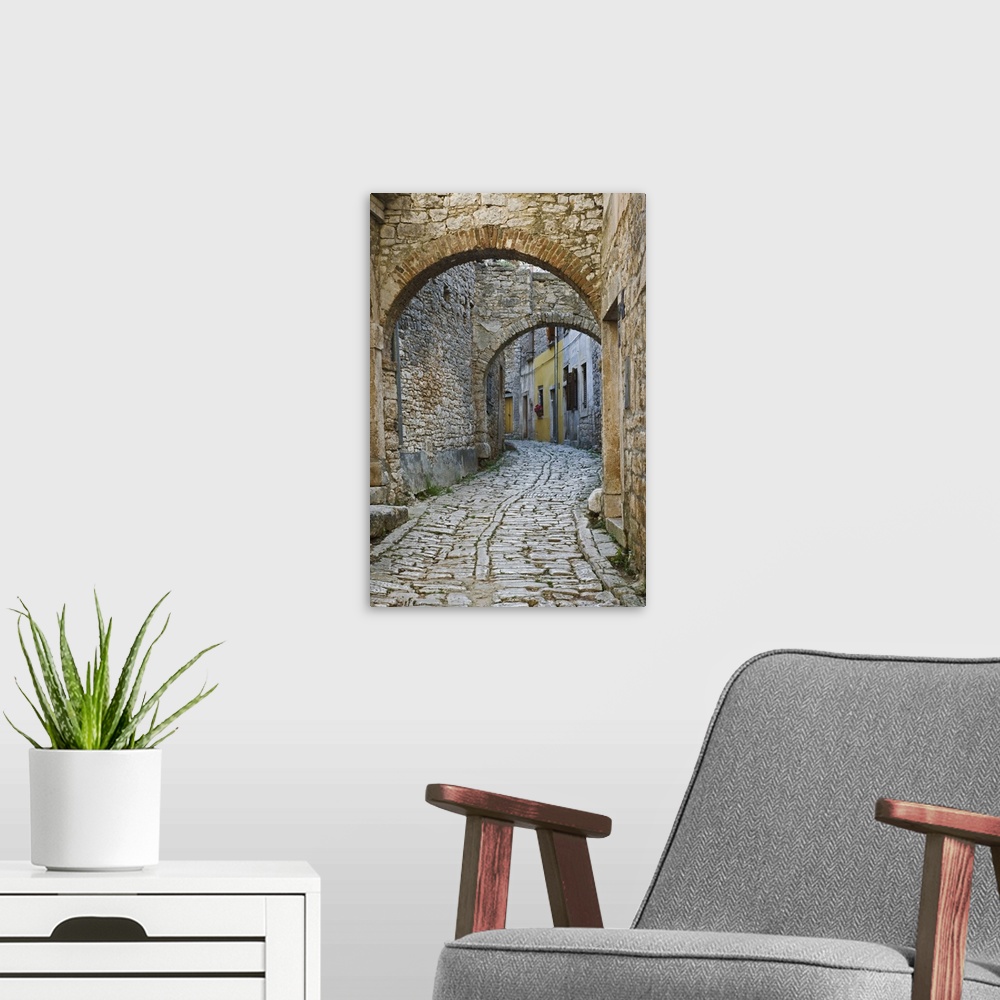 A modern room featuring Twin arches above cobblestone stree, Bale, Croatia