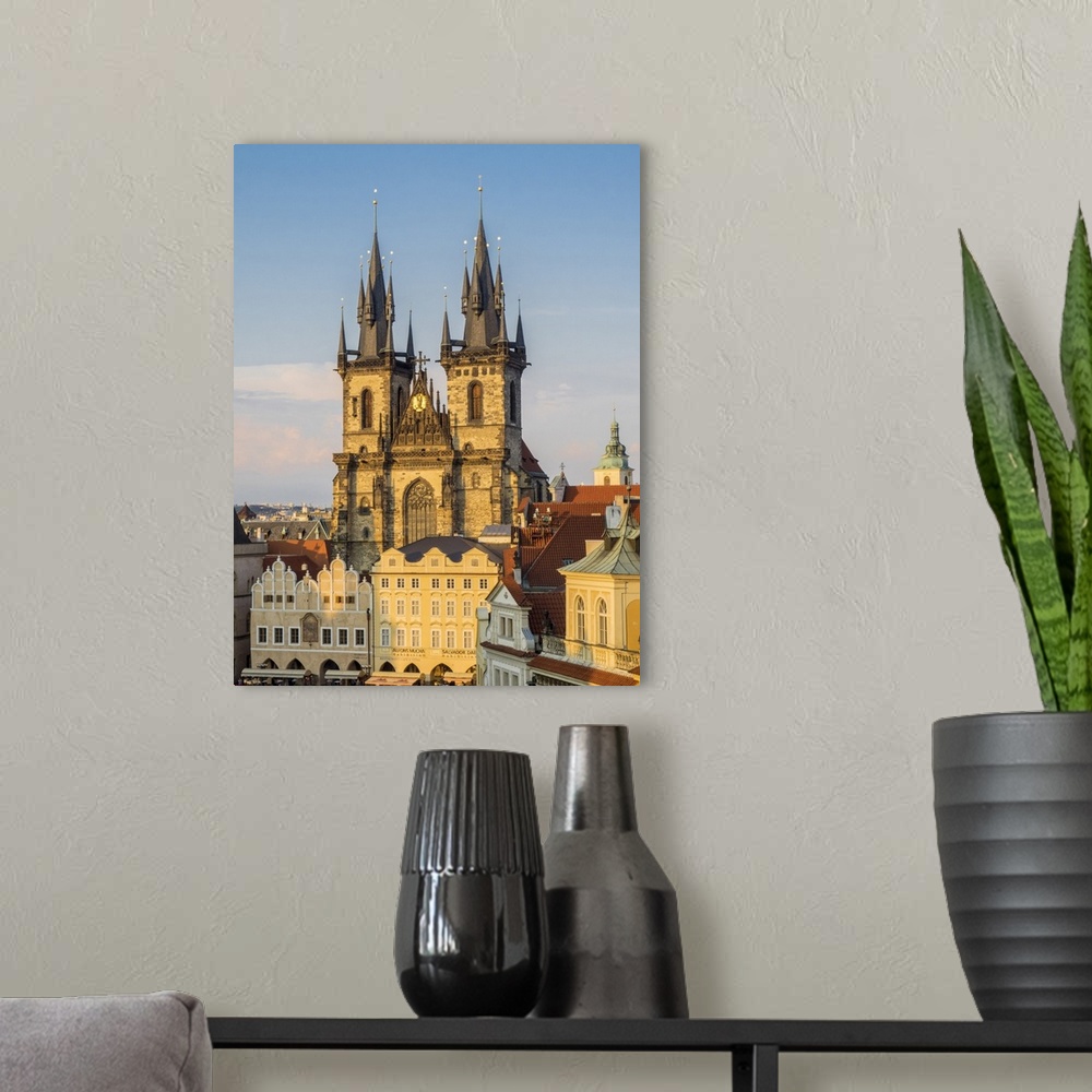 A modern room featuring Europe, Czech Republic, Prague.  Tyn Church, founded in 1385, dominates one side of the Old Town ...