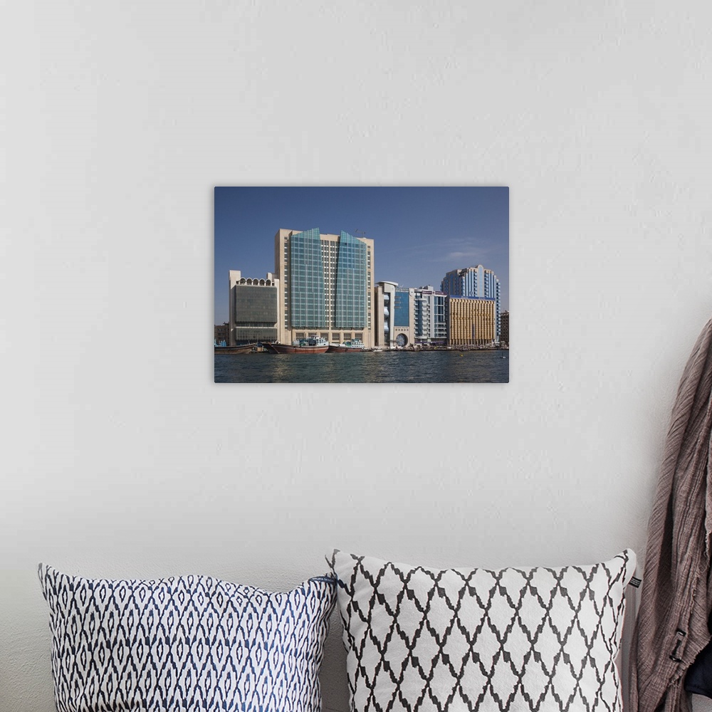 A bohemian room featuring UAE, Dubai, Deira, waterfront buildings by Dubai Creek