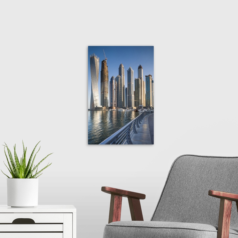 A modern room featuring UAE, Dubai, Dubai Marina, high rise buildings including the twisted Cayan Tower, morning