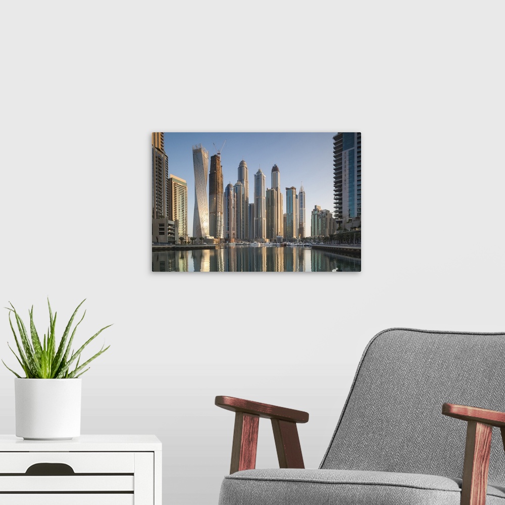 A modern room featuring UAE, Dubai, Dubai Marina, high rise buildings including the twisted Cayan Tower, morning