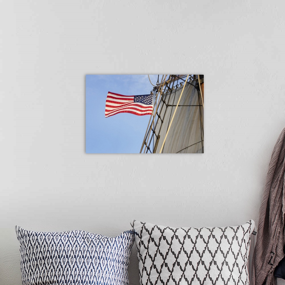 A bohemian room featuring United States flag flying on Hawaiian Chieftain, a Square Topsail Ketch. Owned and operated by th...