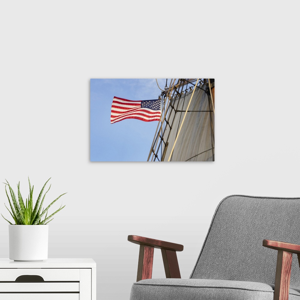 A modern room featuring United States flag flying on Hawaiian Chieftain, a Square Topsail Ketch. Owned and operated by th...