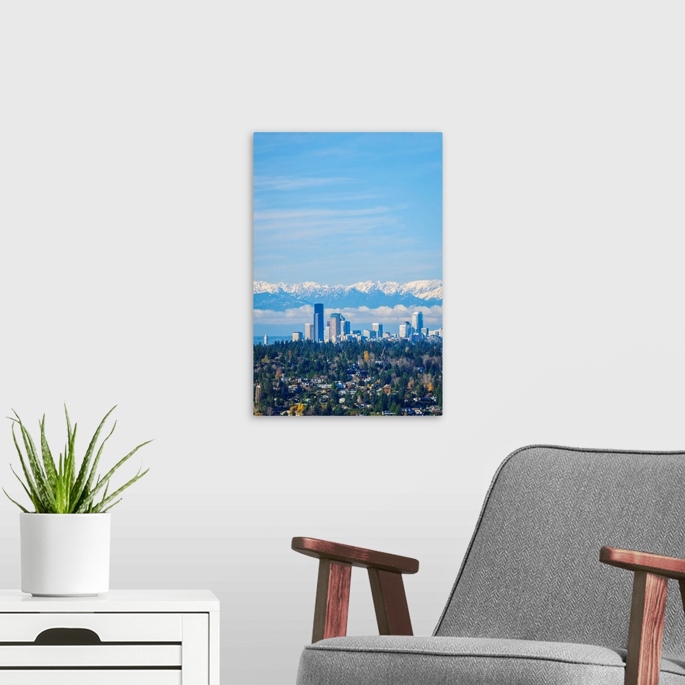 A modern room featuring United States, Washington. Seattle skyline and Olympic mountains viewed from Bellevue.