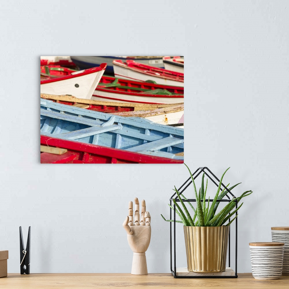 A bohemian room featuring Colorful traditional fishing boats at the historic waterfront. Cidade Velha, historic center of R...