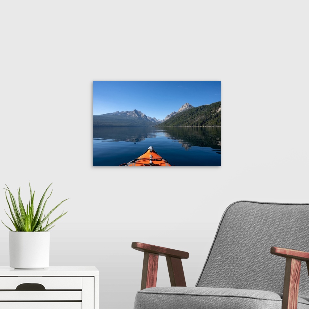A modern room featuring USA, Idaho, Redfish Lake. Kayak facing Sawtooth Mountains. United States, Idaho.