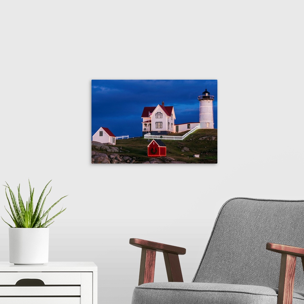 A modern room featuring USA, Maine, York Beach, Nubble Light Lighthouse with Christmas decorations at dusk