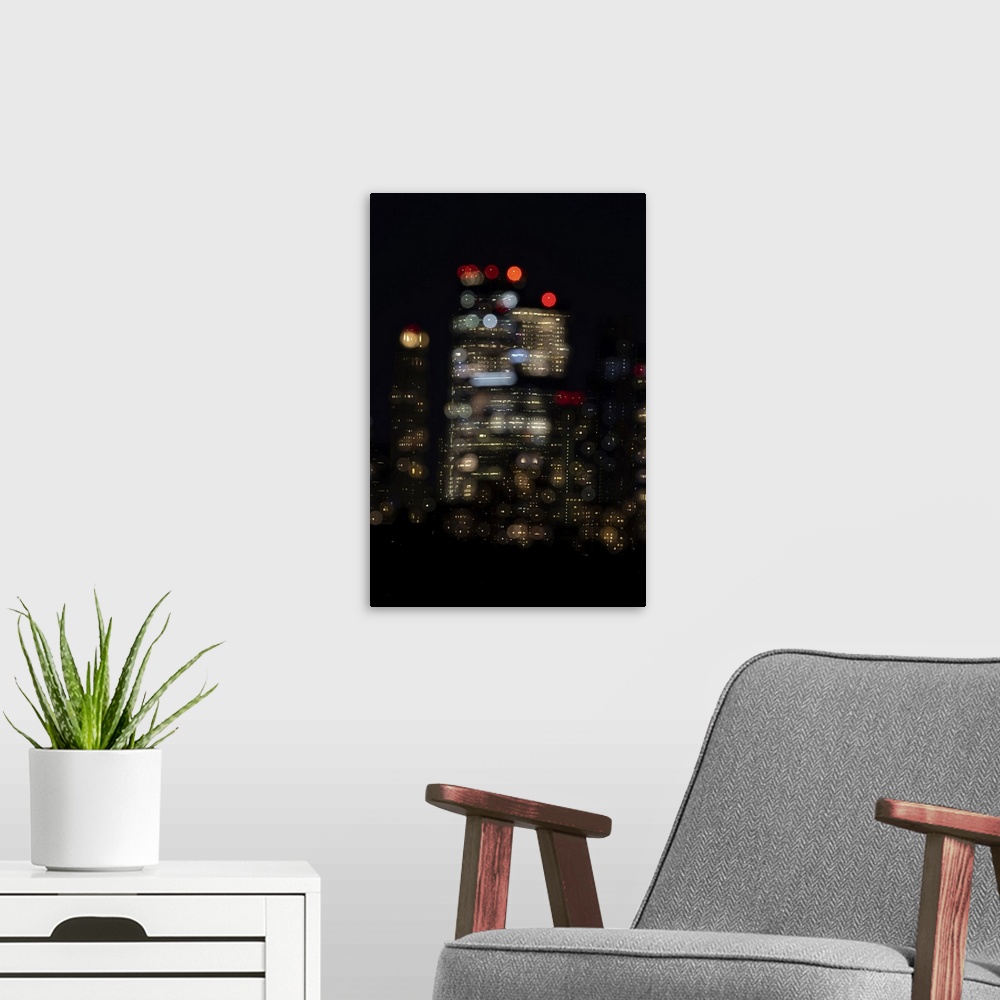 A modern room featuring USA, New York. New York City skyline at night double exposure. United States, New York.
