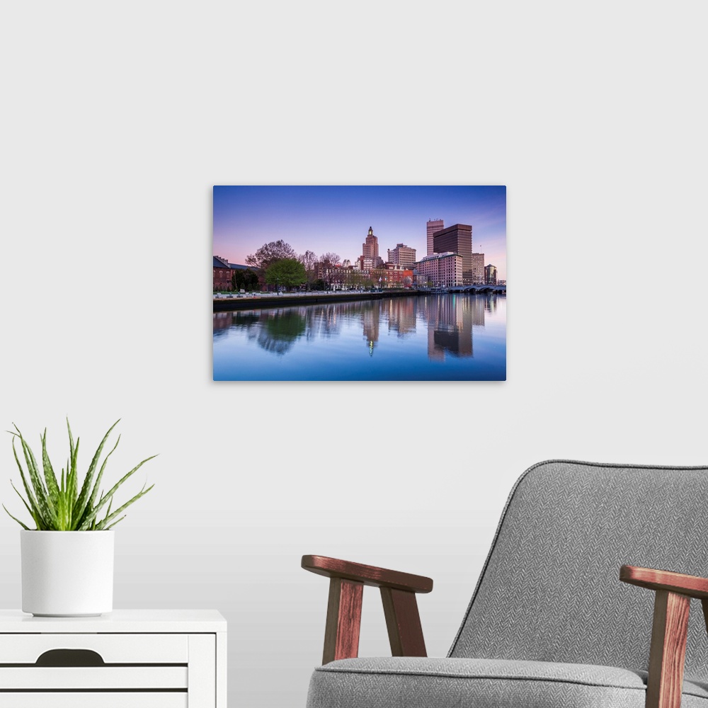 A modern room featuring USA, Rhode Island, Providence, city skyline from the Providence River at dawn