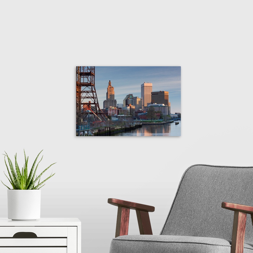A modern room featuring USA, Rhode Island, Providence, city skyline from the Providence River at dawn
