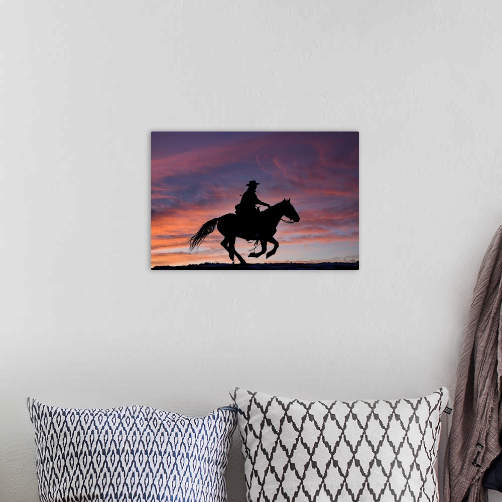 A bohemian room featuring USA, Shell, Wyoming, Hideout Ranch Cowgirl Silhouetted On Horseback At Sunset