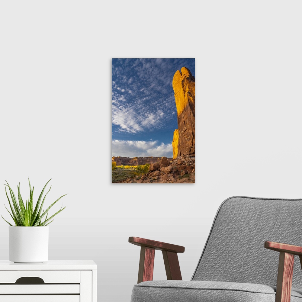 A modern room featuring USA, Utah. Cliffs, clouds, and autumn cottonwoods at sunset, Arches National Park.