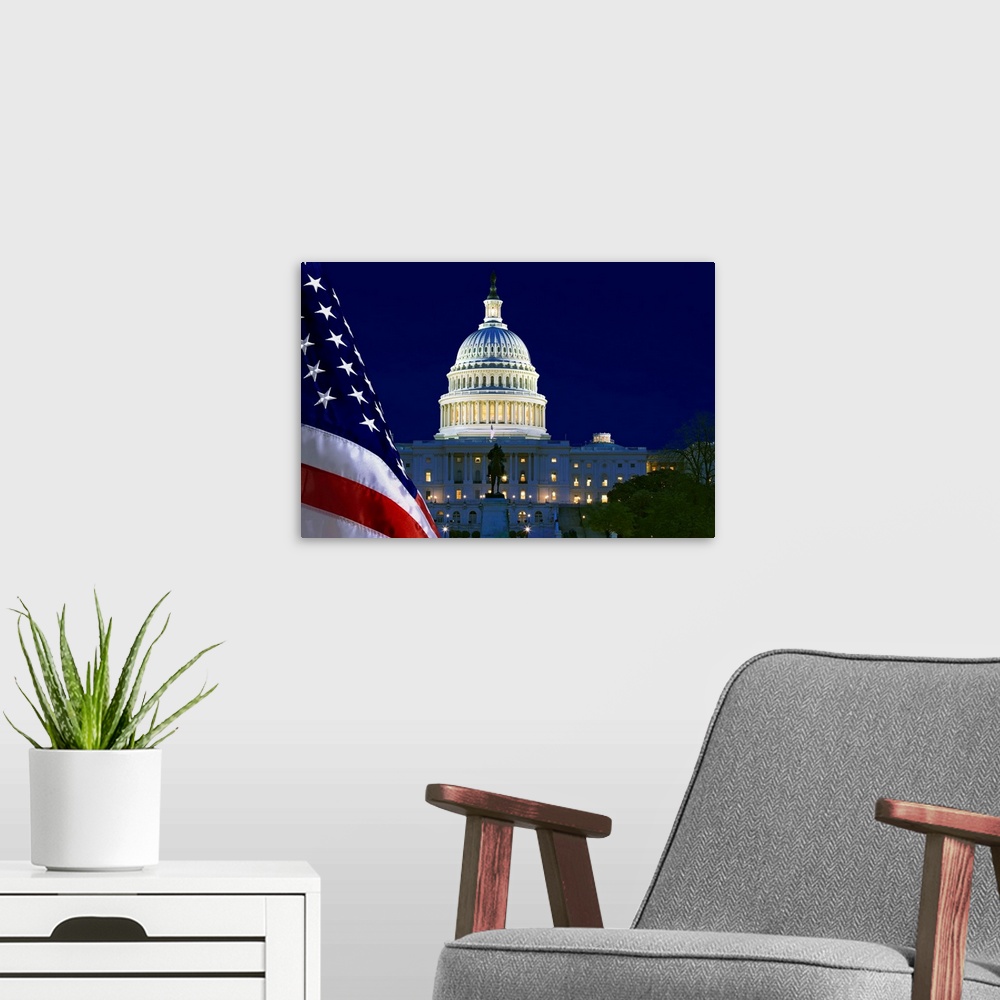 A modern room featuring USA, Washington, DC. Capitol Building and US flag at night.