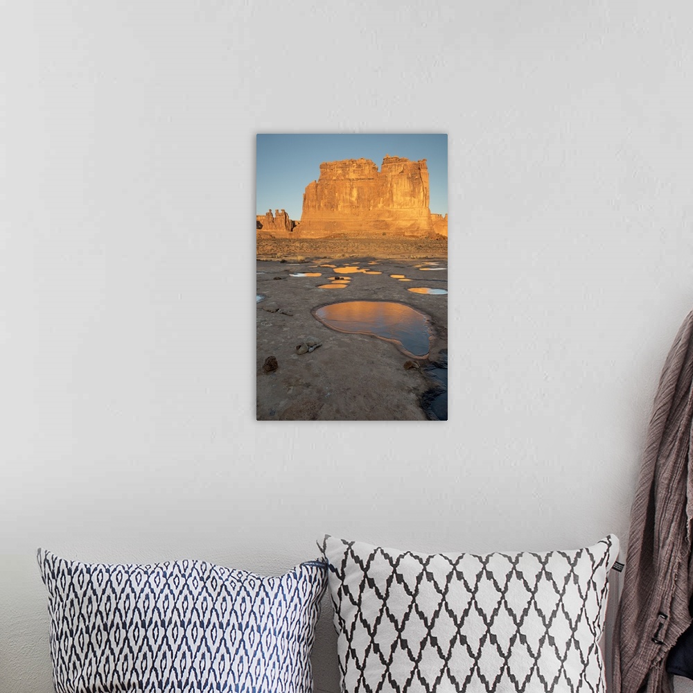 A bohemian room featuring North America, USA, Utah, Arches National Park.  Reflected light  from the Organ in icy pot holes...