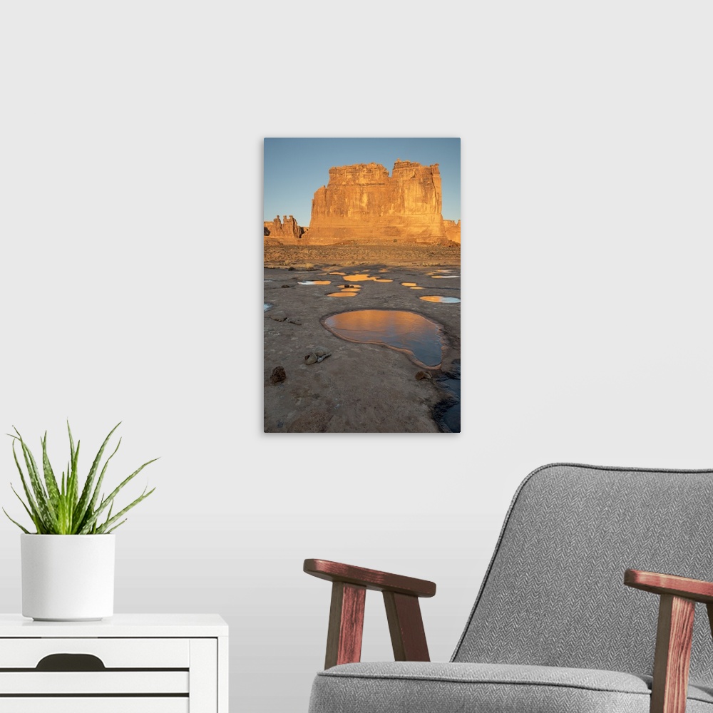 A modern room featuring North America, USA, Utah, Arches National Park.  Reflected light  from the Organ in icy pot holes...