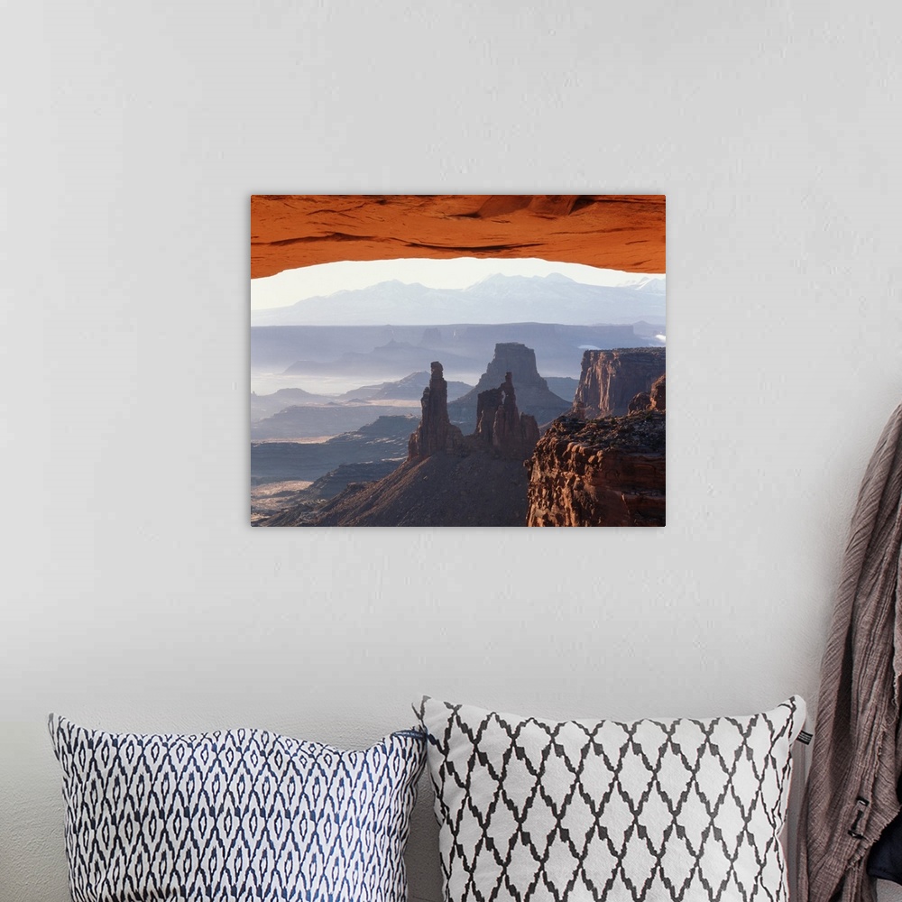 A bohemian room featuring Utah, Canyonlands National Park, View of Mesa Arch at sunrise.