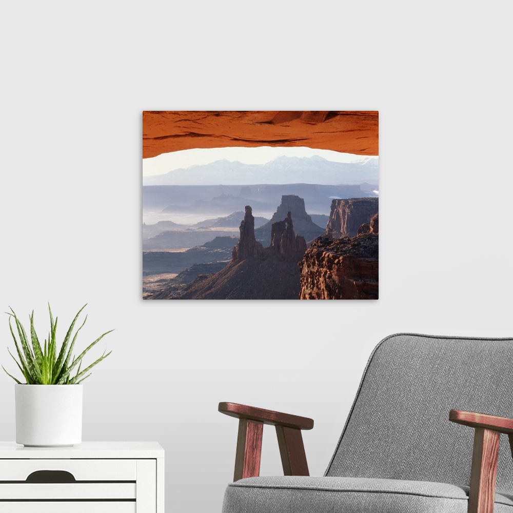 A modern room featuring Utah, Canyonlands National Park, View of Mesa Arch at sunrise.