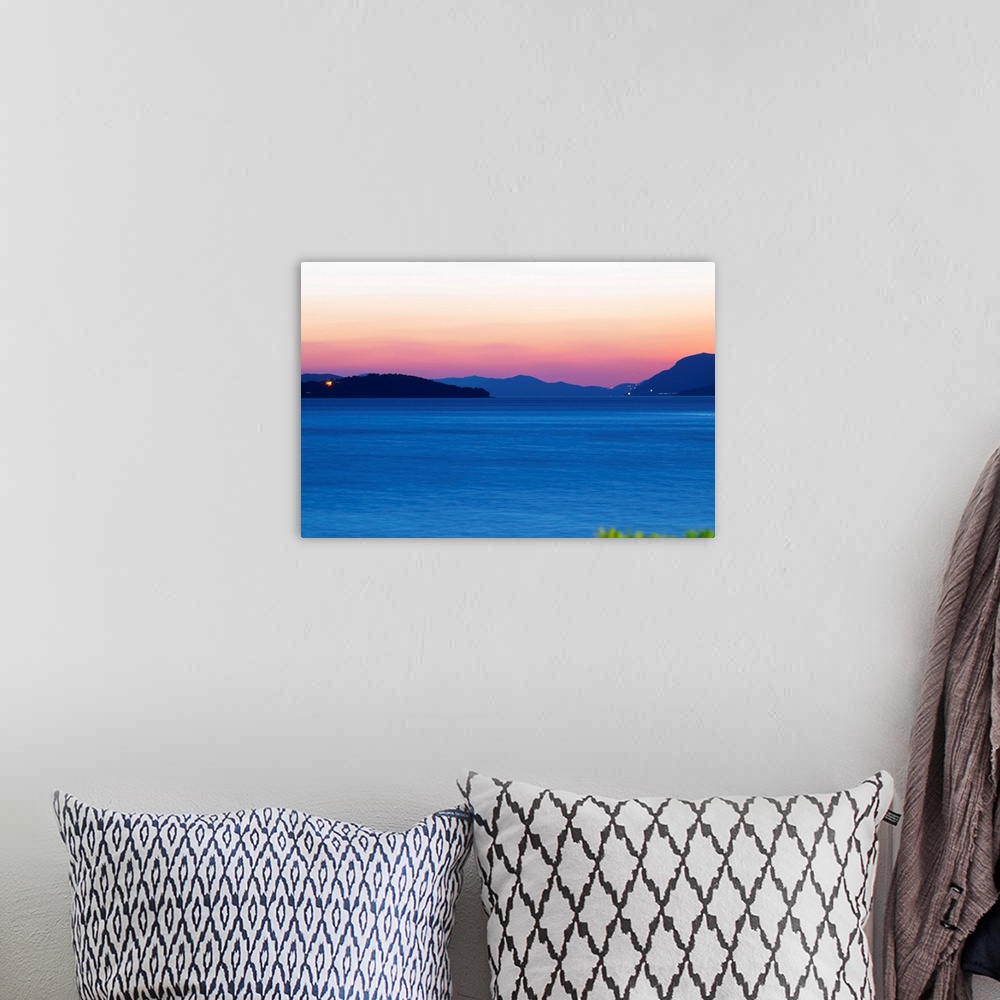 A bohemian room featuring Sunset over the sea. View over the islands Daksa and others. House lights. Dark blue sea. Uvala S...
