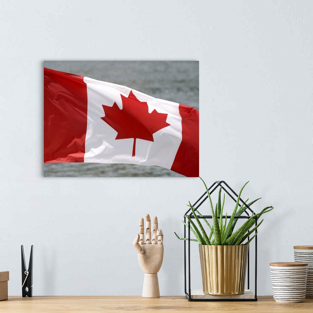 A bohemian room featuring Victoria, Canada. Canadian flag flying