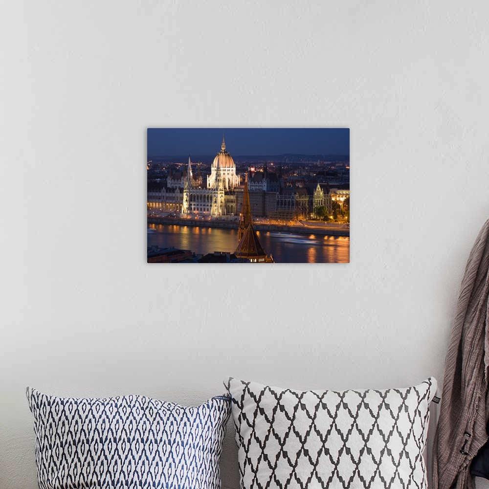 A bohemian room featuring View of Parliament Buildings along Danube River at dusk, Budapest, Capital of Hungary, Europe