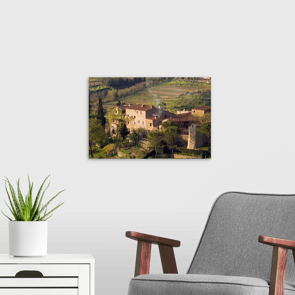 A modern room featuring Stone buildings perch on the vineyard-covered hills above the rural town of Lamole, in the Tuscan...