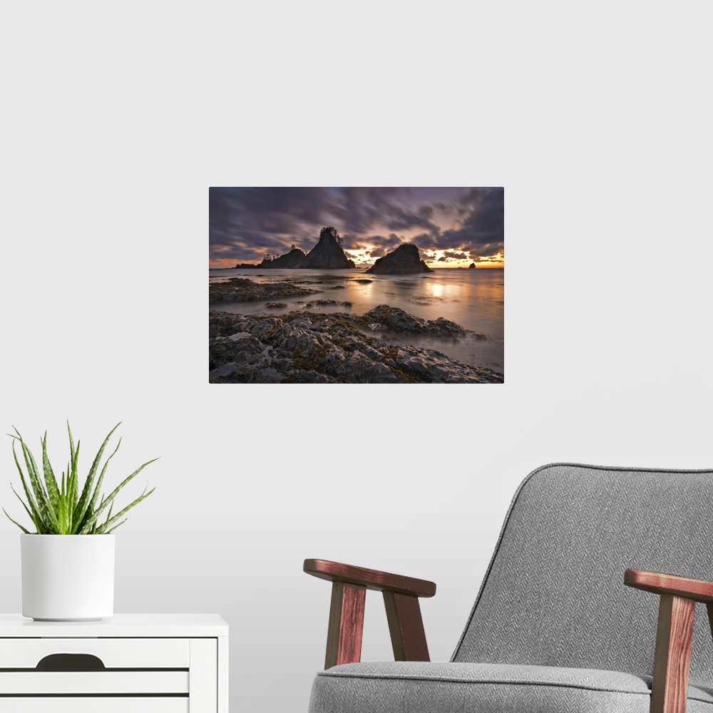 A modern room featuring USA, Washington, Olympic National Park.  Clouds streak past the Olympic coastline at dusk.