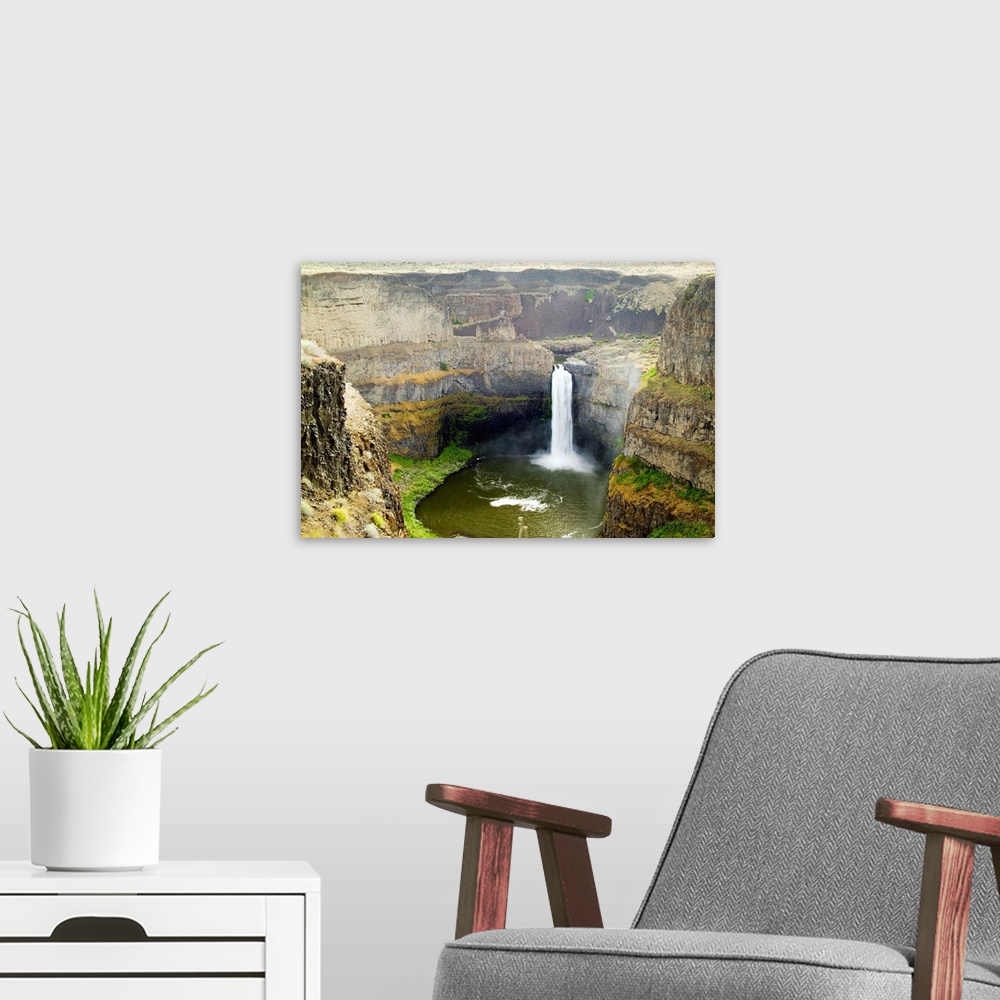 A modern room featuring Washington, Palouse Waterfalls with Spring water flow.