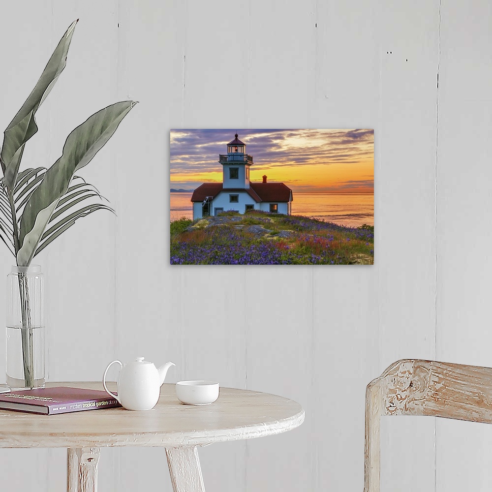 A farmhouse room featuring USA, Washington, San Juan Islands. Patos Lighthouse and camas flowers at sunset.