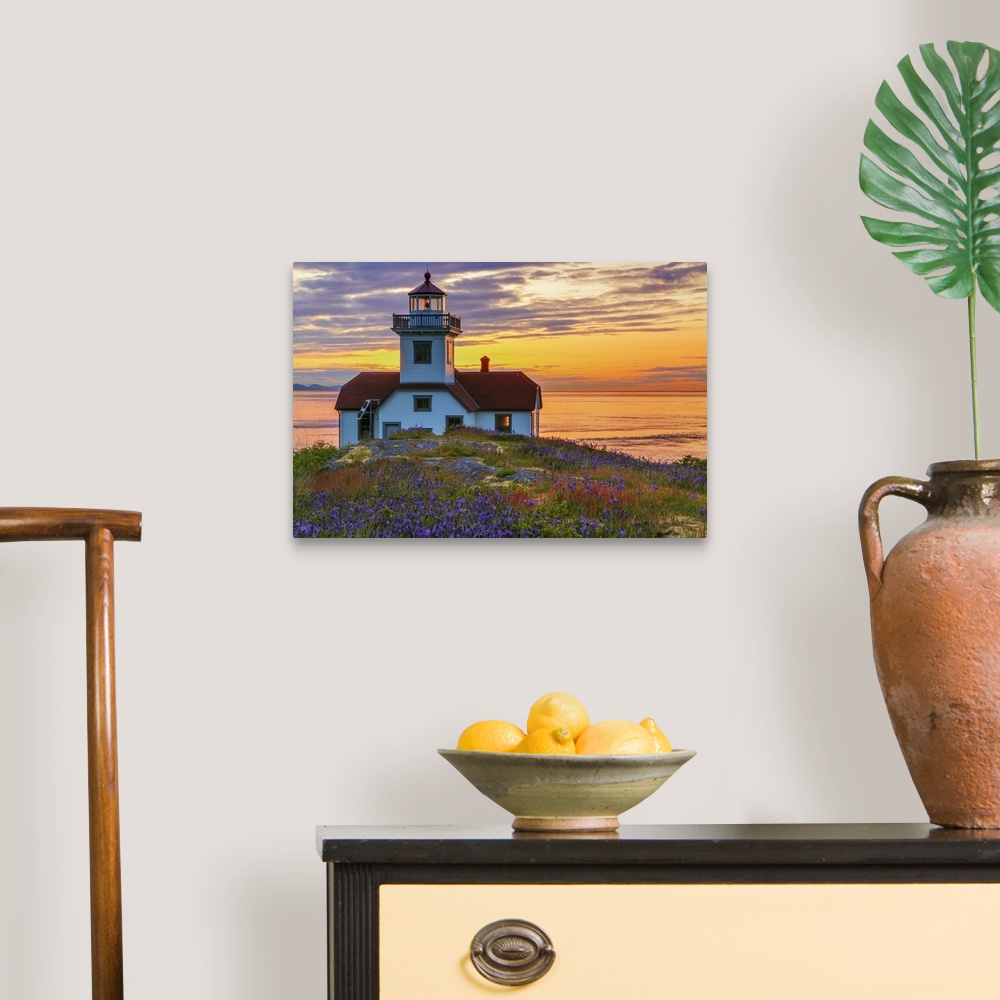 A traditional room featuring USA, Washington, San Juan Islands. Patos Lighthouse and camas flowers at sunset.