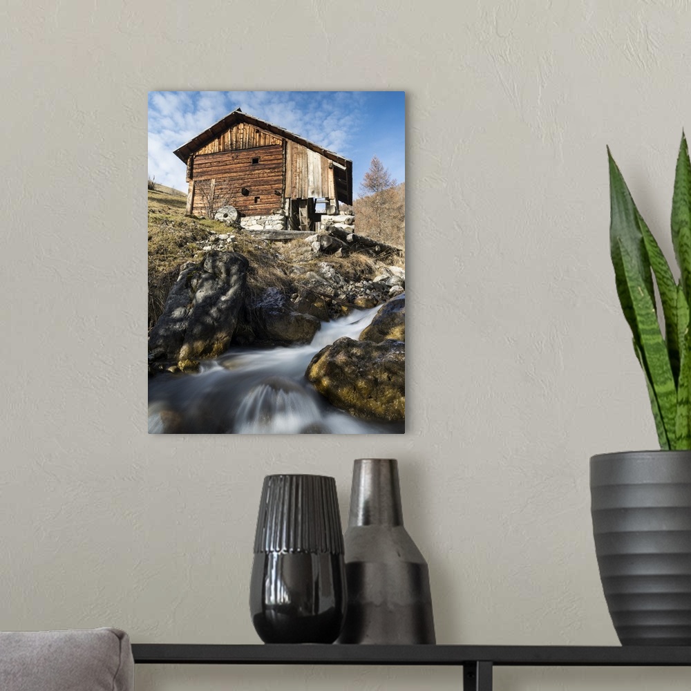 A modern room featuring Water mills of the viles of Mischi und Seres, village of Campill. Central South Tyrol, Italy.