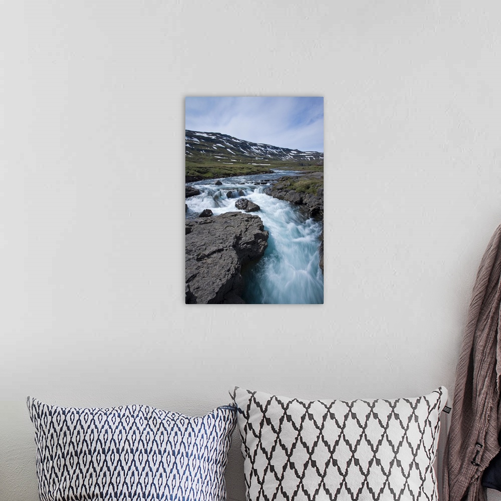 A bohemian room featuring Waterfall in southeastern Iceland.g