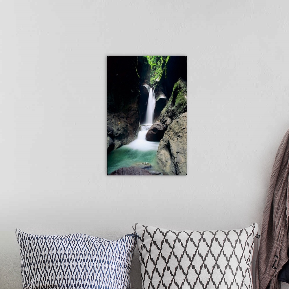 A bohemian room featuring A waterfall plunges through the Gorges de la Falais on the Island of Martinique in the Caribbean ...