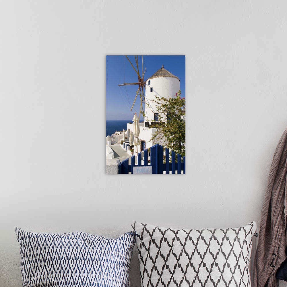 A bohemian room featuring Windmill in cliff top village of Oia, Santorini, Greece