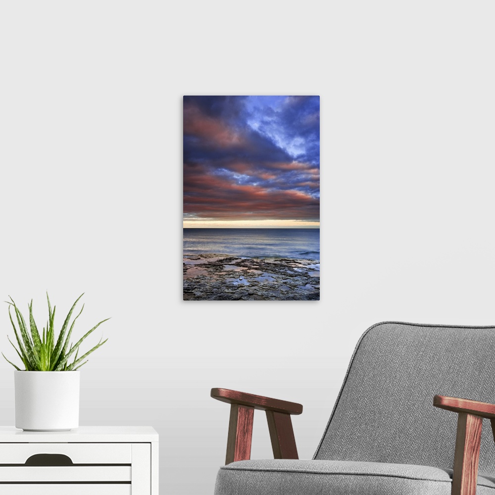 A modern room featuring Wisconsin, sunrise on clouds seen from the shore of Lake Michigan.