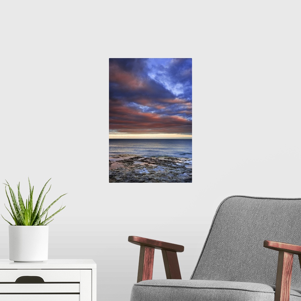 A modern room featuring Wisconsin, sunrise on clouds seen from the shore of Lake Michigan.