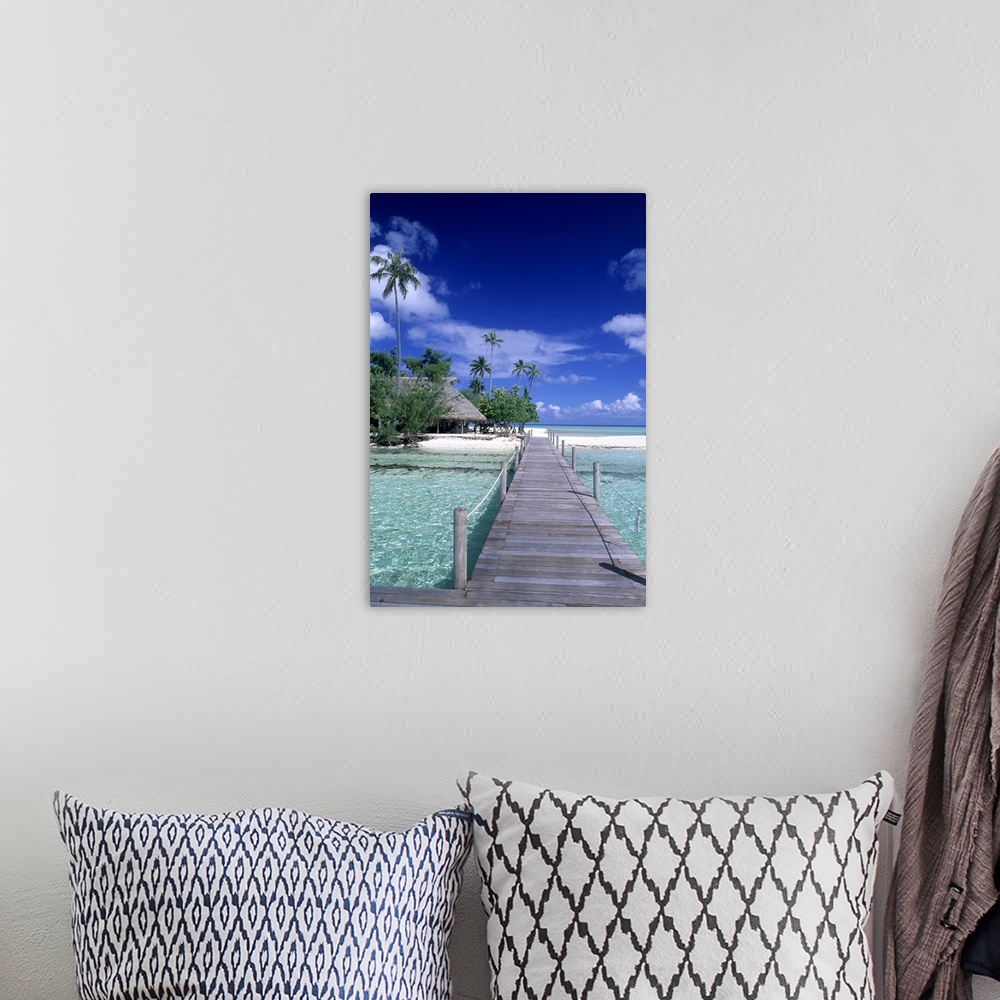 A bohemian room featuring The perfect scene of wooden dock walkway over water in beautiful Tahiti in Bora Bora, French Poly...