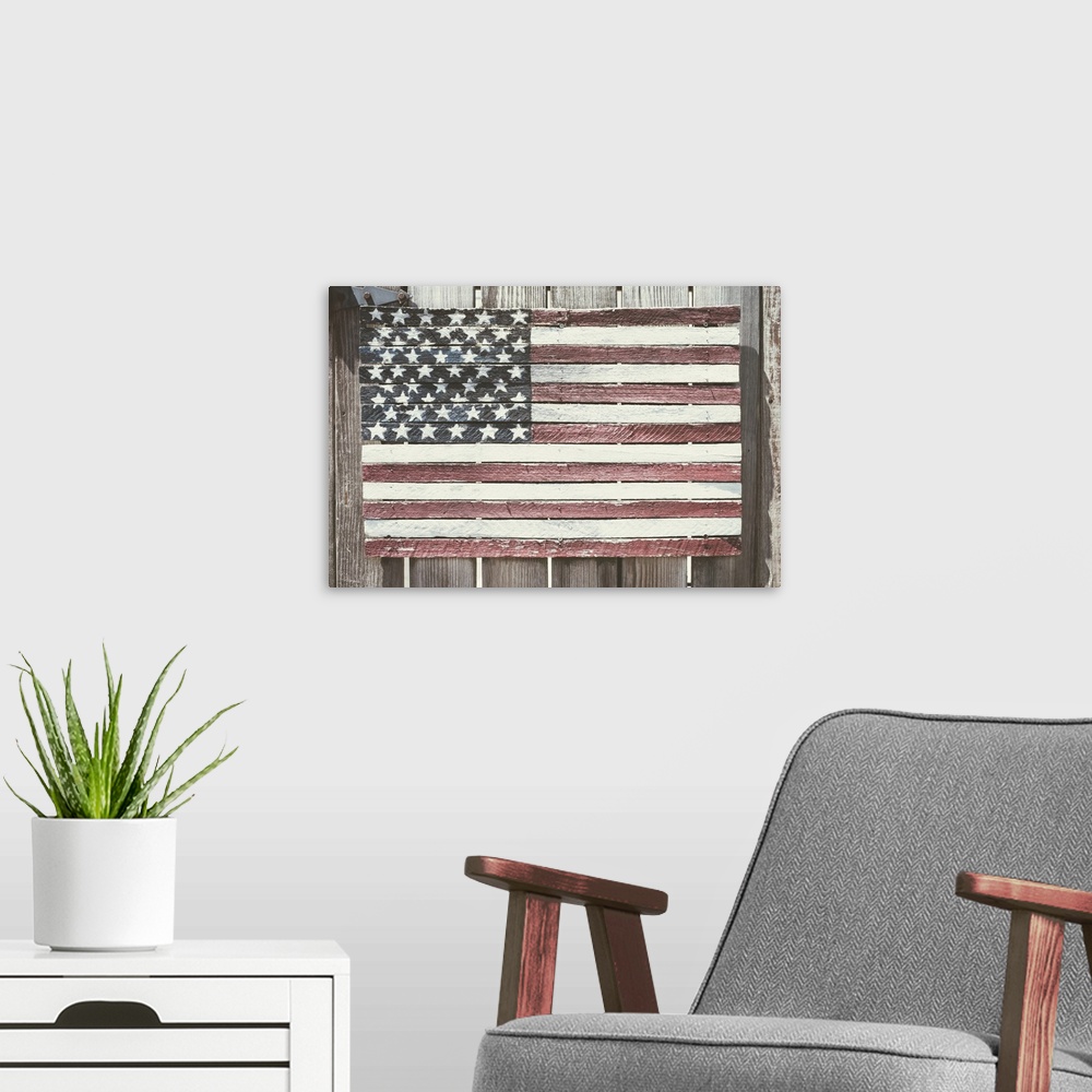 A modern room featuring Worn wooden American flag, Fire Island, New York.