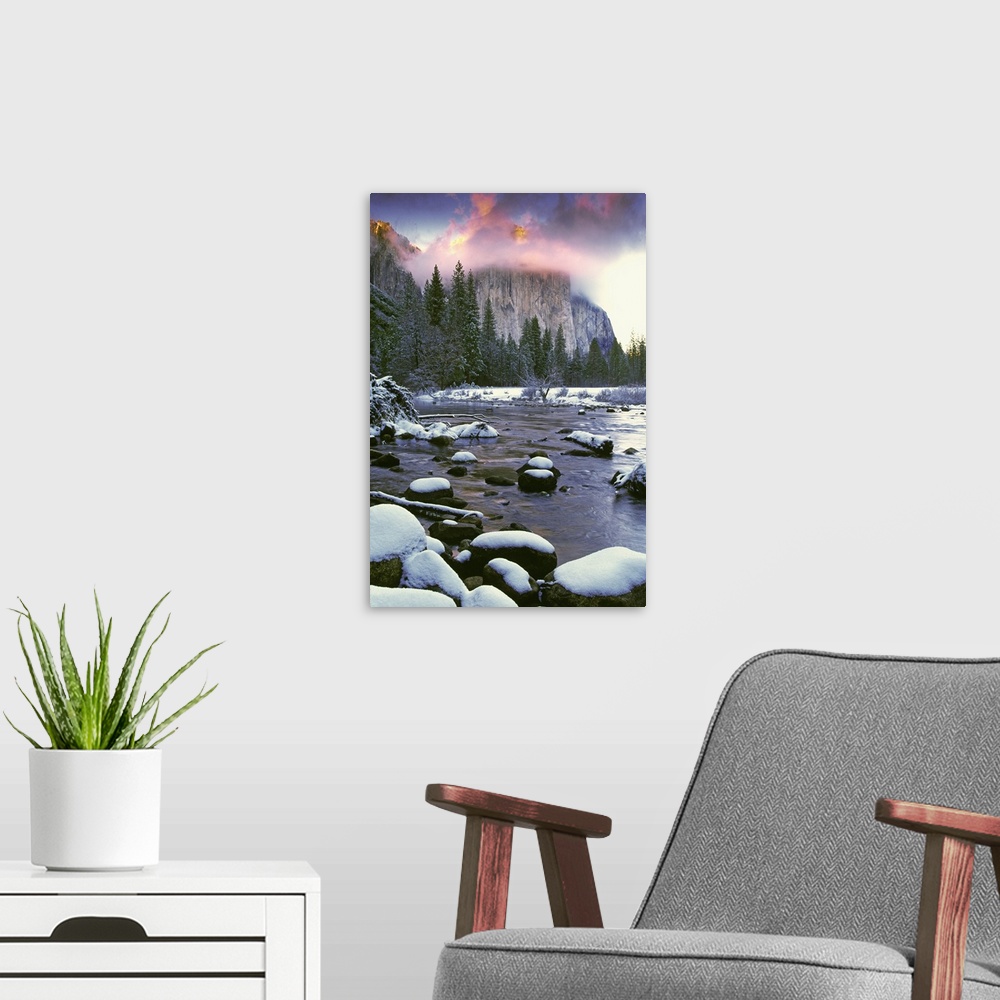 A modern room featuring USA, California, Yosemite National Park. Sunlight on clouds over El Capitan as seen from the Merc...
