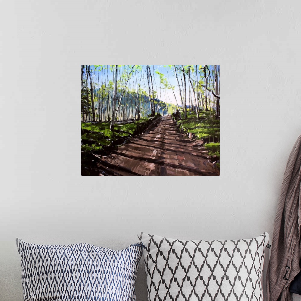 A bohemian room featuring Contemporary painting of a dirt road through a forest in Colorado.